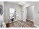 Inviting entryway with wood-look floors and natural light from a window at 111 Magnolia Blvd, Pahrump, NV 89048