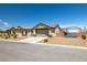 Single-story home boasts desert landscaping, two-car garage, and rear shed at 111 Magnolia Blvd, Pahrump, NV 89048