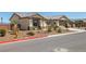 Attractive home featuring desert landscaping, a two-car garage and brick fencing at 111 Magnolia Blvd, Pahrump, NV 89048