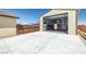 View of the property's open garage showcasing concrete flooring and plenty of workspace at 111 Magnolia Blvd, Pahrump, NV 89048