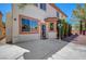 Exterior view of backyard with stucco wall, light fixtures, and entry door at 11444 Steponia Bay St, Las Vegas, NV 89141