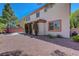 This home boasts a quaint backyard with gravel and a shaded patio, perfect for relaxation at 11444 Steponia Bay St, Las Vegas, NV 89141
