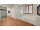 Bathroom with tub, glass shower, and window at 11444 Steponia Bay St, Las Vegas, NV 89141
