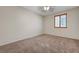 Spacious carpeted bedroom with window at 11444 Steponia Bay St, Las Vegas, NV 89141