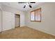 A bright bedroom featuring double door closet, soft carpet and window with wood blinds at 11444 Steponia Bay St, Las Vegas, NV 89141