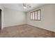 Carpeted bedroom with window at 11444 Steponia Bay St, Las Vegas, NV 89141