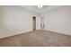 Carpeted bedroom with open door to another room at 11444 Steponia Bay St, Las Vegas, NV 89141