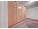 Garage with lots of storage space with custom built in cabinets and epoxy floor at 11444 Steponia Bay St, Las Vegas, NV 89141