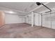 Spacious three-car garage with high ceilings and ample room for vehicles and storage at 11444 Steponia Bay St, Las Vegas, NV 89141