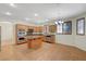 Spacious kitchen with stainless appliances, granite countertops, and a central island at 11444 Steponia Bay St, Las Vegas, NV 89141