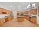 Spacious kitchen with wood cabinets, granite counters, and stainless steel appliances at 11444 Steponia Bay St, Las Vegas, NV 89141