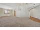 Spacious living room with plush carpeting, lots of natural light and an open layout at 11444 Steponia Bay St, Las Vegas, NV 89141