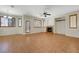 Open living area with tile flooring, fireplace, and access to the backyard patio at 11444 Steponia Bay St, Las Vegas, NV 89141