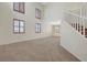 Spacious living room with plush carpeting, lots of natural light and an open layout at 11444 Steponia Bay St, Las Vegas, NV 89141