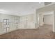 Open loft area featuring soft carpet, neutral paint, and an elegant chandelier at 11444 Steponia Bay St, Las Vegas, NV 89141
