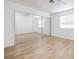 Spacious bedroom with light wood flooring and a large mirrored closet at 1300 Pinto Rock Ln # 201, Las Vegas, NV 89128