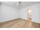View of the bedroom showing wood floors and bathroom access at 1300 Pinto Rock Ln # 201, Las Vegas, NV 89128