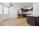 Modern kitchen with stainless steel appliances, granite countertops, and dark wood cabinetry with a window at 1300 Pinto Rock Ln # 201, Las Vegas, NV 89128