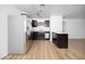 Modern kitchen featuring stainless steel appliances, granite countertops, and dark wood cabinets at 1300 Pinto Rock Ln # 201, Las Vegas, NV 89128