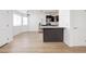 Open floorplan between kitchen and living room with hardwood flooring at 1300 Pinto Rock Ln # 201, Las Vegas, NV 89128