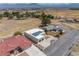Spacious single-Gathering home featuring solar panels, desert landscaping, and a private driveway in a quiet neighborhood at 1320 Daytona St, Pahrump, NV 89048