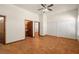Large bedroom with tile flooring and a view into the bathroom at 1320 Daytona St, Pahrump, NV 89048