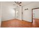 Bedroom with brick accent wall, tile flooring, and double closet at 1320 Daytona St, Pahrump, NV 89048