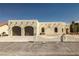 Exterior of a single-story home with desert landscaping and a circular driveway at 1320 Daytona St, Pahrump, NV 89048