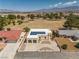 Charming home featuring a unique architecture, solar panels, desert landscaping, and a spacious two-car garage at 1320 Daytona St, Pahrump, NV 89048
