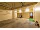 Spacious garage with ample storage cabinets, overhead lighting, and a clean concrete floor at 1320 Daytona St, Pahrump, NV 89048