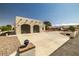 View of garage and long driveway with circular turnaround at 1320 Daytona St, Pahrump, NV 89048