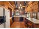 View of kitchen with wood cabinets, tile floor, and stainless steel appliances at 1320 Daytona St, Pahrump, NV 89048