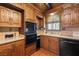 Traditional eat-in kitchen featuring oak cabinets and black appliances at 1320 Daytona St, Pahrump, NV 89048