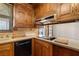 The kitchen showcases oak cabinets and white countertops at 1320 Daytona St, Pahrump, NV 89048