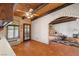 Open kitchen featuring tile floors, wood cabinets, and views of living room at 1320 Daytona St, Pahrump, NV 89048