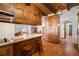 View of the kitchen with bar stool seating and exposed beam ceiling at 1320 Daytona St, Pahrump, NV 89048