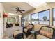 Inviting sunroom with comfortable seating, ceiling fans, and large windows offering scenic views at 1320 Daytona St, Pahrump, NV 89048