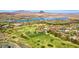 Breathtaking aerial view of the Lake Las Vegas community, golf course, and surrounding mountains at 153 Via Di Mello, Henderson, NV 89011