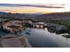 Breathtaking aerial view showcasing the stunning waterfront community at sunset, complete with lakeside access at 153 Via Di Mello, Henderson, NV 89011