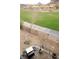 Backyard with lush greenery, open spaces, BBQ, and views of the surrounding community at 153 Via Di Mello, Henderson, NV 89011