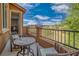 Enjoy views of the mountains and golf course from this comfortable outdoor balcony at 153 Via Di Mello, Henderson, NV 89011