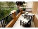 Relaxing balcony with outdoor seating and scenic views of lush greenery and mountains at 153 Via Di Mello, Henderson, NV 89011