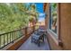 Relax on the balcony surrounded by lush trees and foliage at 153 Via Di Mello, Henderson, NV 89011