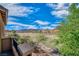 Balcony view overlooks the green fairways, mountains, and blue sky at 153 Via Di Mello, Henderson, NV 89011