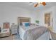 Comfortable bedroom with neutral tones, a plush bed, and a view of the bathroom at 153 Via Di Mello, Henderson, NV 89011