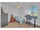 This simple bedroom offers a restful atmosphere with a single bed and view to the outdoors at 153 Via Di Mello, Henderson, NV 89011