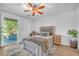 Bright bedroom with stylish furnishings, neutral tones and access to backyard at 153 Via Di Mello, Henderson, NV 89011