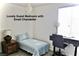 Charming bedroom showcasing a twin bed, desk, and a lovely chandelier at 153 Via Di Mello, Henderson, NV 89011