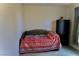 Comfortable bedroom with a colorful quilt and dark cabinet for ample storage space at 153 Via Di Mello, Henderson, NV 89011