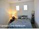 Inviting bedroom featuring neutral bedding, a bedside table, and stylish decor at 153 Via Di Mello, Henderson, NV 89011